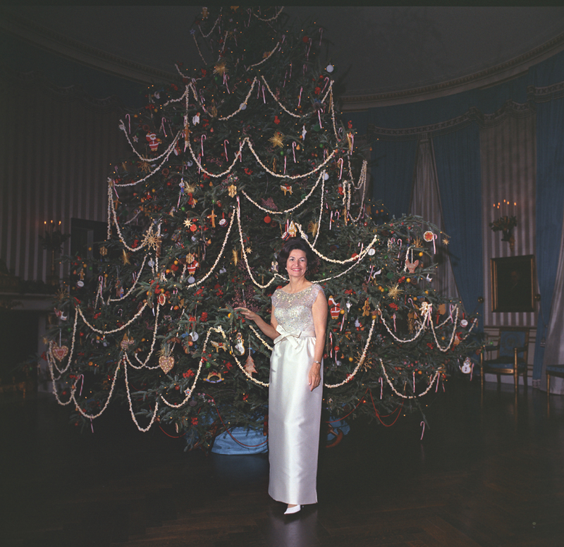 Illustration for article titled 70 Years of First Ladies Standing in Front of Christmas TreesÂ